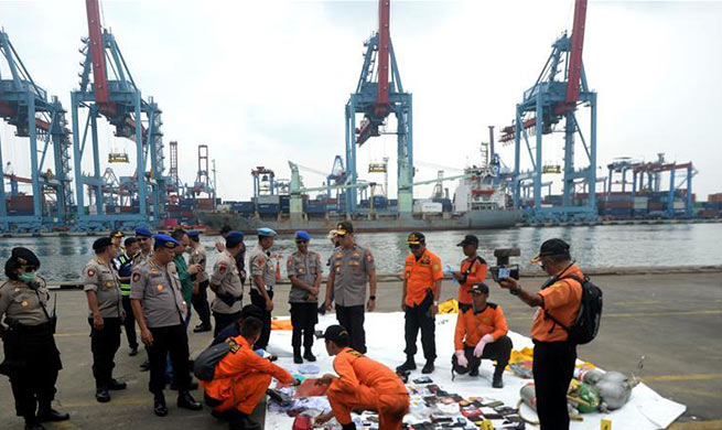 Indonesian rescuers retrieve 24 bags of body parts following plane crash