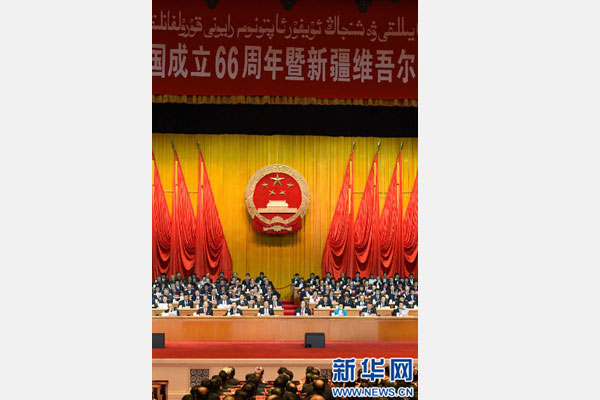 10月1日，慶祝中華人民共和國成立66周年暨新疆維吾爾自治區(qū)成立60周年大會(huì)在新疆人民會(huì)堂隆重舉行。 新華社記者 高潔 攝 